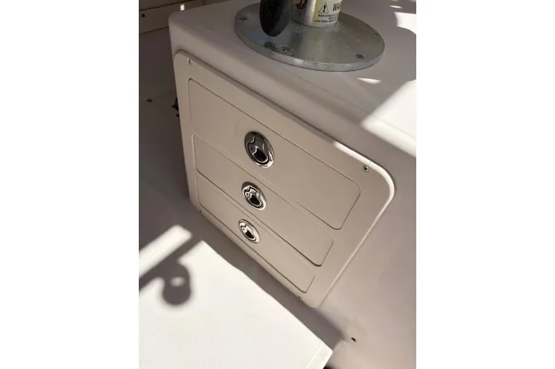 Slide: The Image of 2003 Grady-White Marlin 300 boat storage compartments with secure latches. - 44