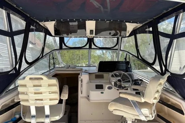 Slide: The Image of Interior view of a 2003 Grady-White Marlin 300 boat cockpit with seating and controls. - 46