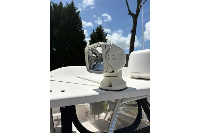 Slide: The Image of Spotlight on 2003 Grady-White Marlin 300 boat under clear blue sky. - 49