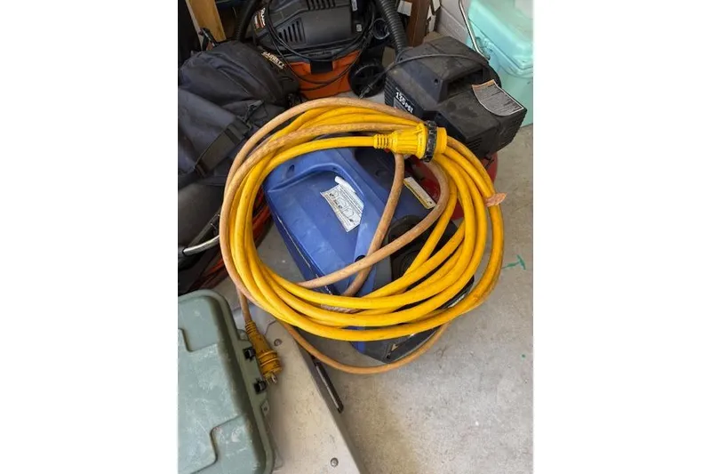 Slide: The Image of Coiled yellow extension cord on a Grady-White Marlin 300, 2003 model. - 57