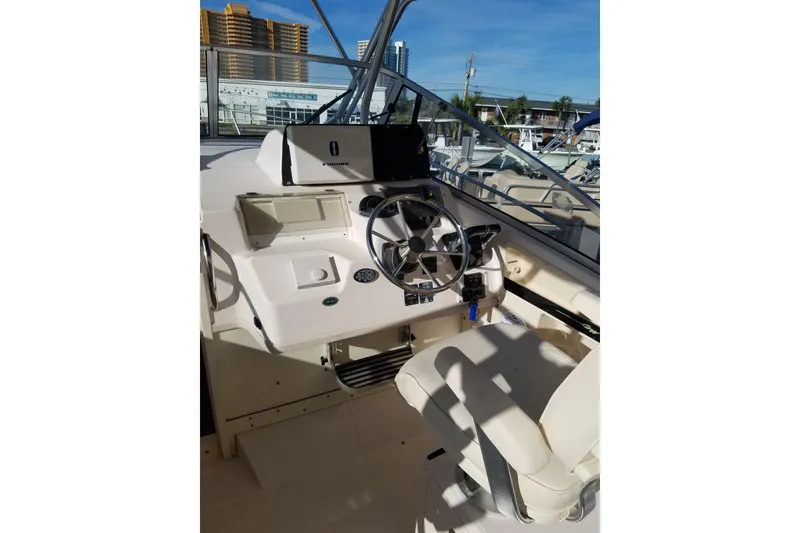 Slide: The Image of Helm of 2003 Grady-White Marlin 300 boat with steering wheel and controls. - 6
