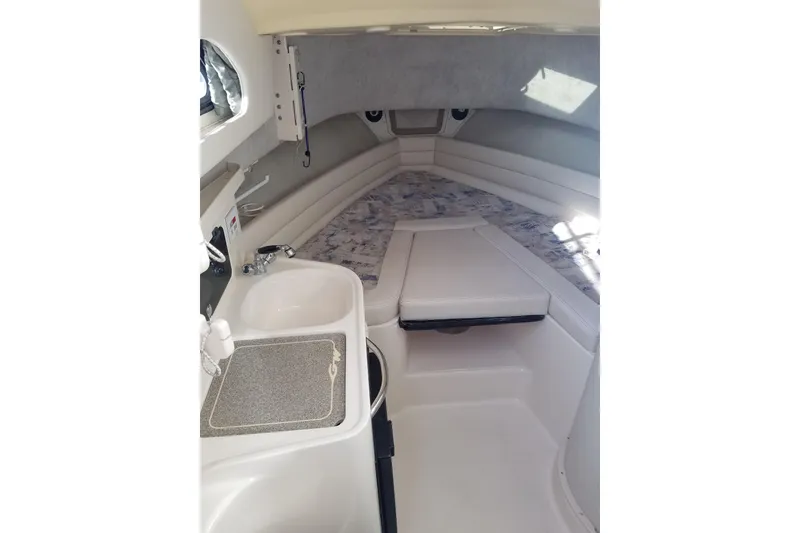 Slide: The Image of 2003 Grady-White Marlin 300 cabin interior with sink and seating area. - 7
