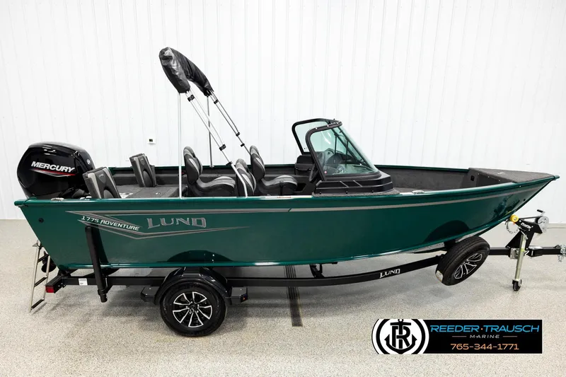 The Image of 2026 Lund 1775 Adventure Sport boat with Mercury engine on trailer in showroom. - 1