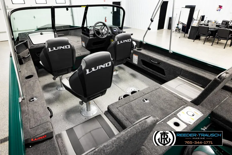 Slide: The Image of 2026 Lund 1775 Adventure Sport boat interior with seating and steering console. - 10