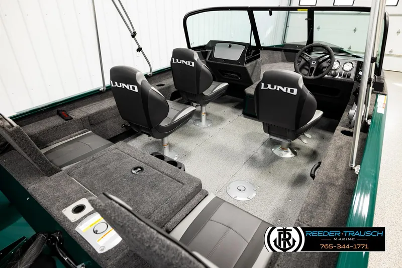 Slide: The Image of 2026 Lund 1775 Adventure Sport boat interior with seating and steering console. - 11