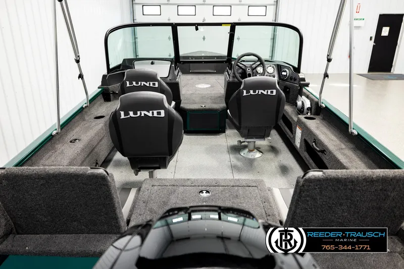 Slide: The Image of 2026 Lund 1775 Adventure Sport boat interior with seating and steering console. - 12
