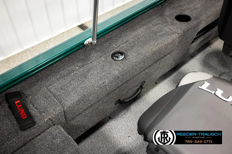 Slide: The Image of 2026 Lund 1775 Adventure Sport boat interior with gray carpet and branded seating. - 22