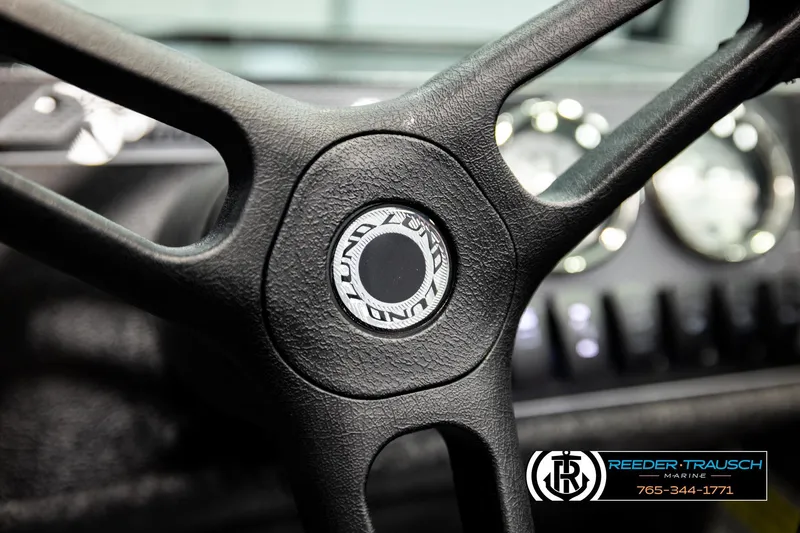 Slide: The Image of Steering wheel of 2026 Lund 1775 Adventure Sport boat, featuring dashboard gauges. - 30