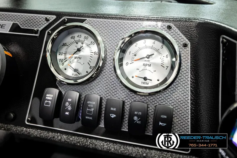 Slide: The Image of Dashboard of 2026 Lund 1775 Adventure Sport with gauges and control switches. - 31