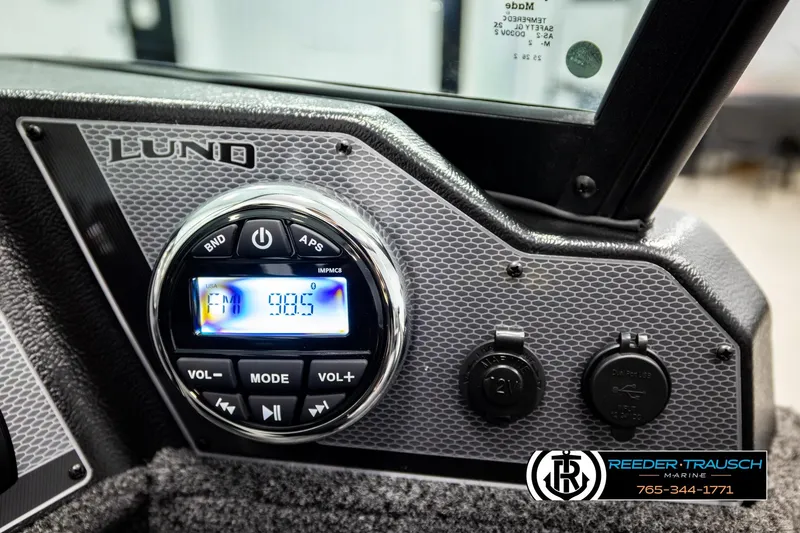 Slide: The Image of Control panel of 2026 Lund 1775 Adventure Sport boat with radio display. - 32