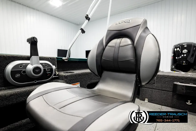 Slide: The Image of 2026 Lund 1775 Adventure Sport boat interior with steering controls and comfortable seating. - 35