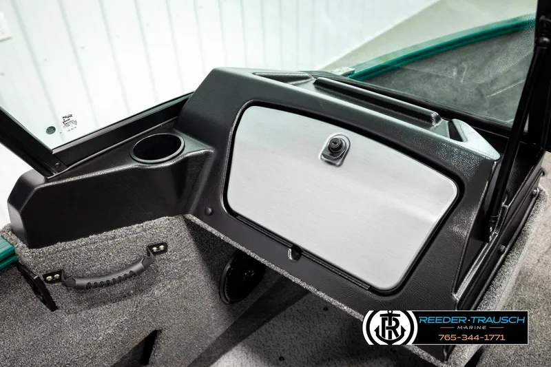 Slide: The Image of 2026 Lund 1775 Adventure Sport boat interior with storage compartment and cup holder. - 37