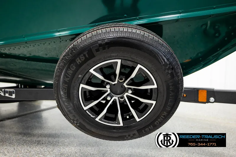 Slide: The Image of 2026 Lund 1775 Adventure Sport trailer wheel with black alloy rim. - 45