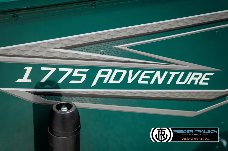 Slide: The Image of 2026 Lund 1775 Adventure Sport boat branding with geometric design and dealership logo. - 48