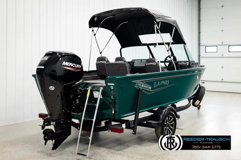 Slide: The Image of 2026 Lund 1775 Adventure Sport boat with Mercury engine in showroom. - 5
