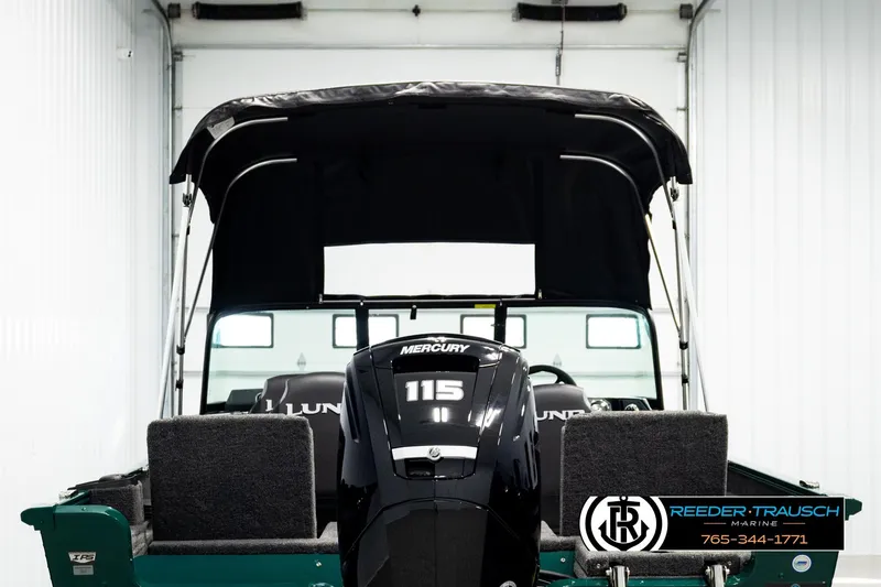 Slide: The Image of 2026 Lund 1775 Adventure Sport boat with Mercury 115 engine in showroom. - 6