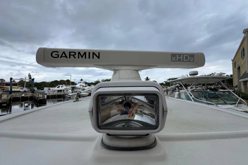 Slide: The Image of Garmin xHD2 radar on 2015 Sailfish 320 CC boat, docked under cloudy skies. - 25