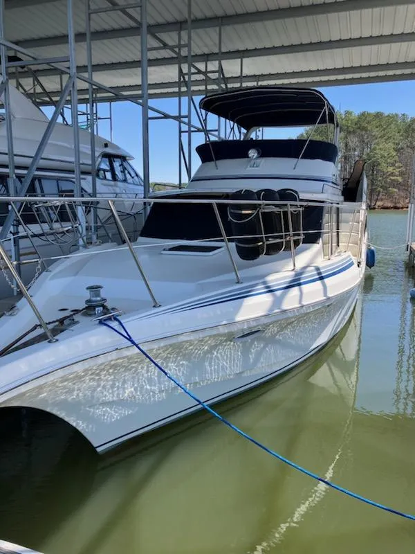 Slide: The Image of 1989 Bluewater Yachts 55' Coastal Cruiser docked in a marina. - 2