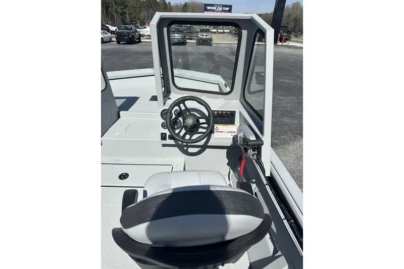 Slide: The Image of 2026 SeaArk 2272 MVT boat interior with steering wheel and control panel. - 5
