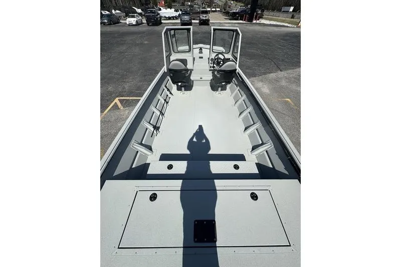 Slide: The Image of 2026 SeaArk 2272 MVT boat interior with dual seats and open deck. - 6