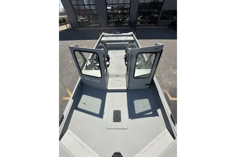 Slide: The Image of 2026 SeaArk 2272 MVT boat with open doors, showcasing spacious interior design. - 8