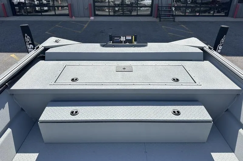 Slide: The Image of 2026 SeaArk 2272 MVT boat interior with storage compartments and non-slip flooring. - 9