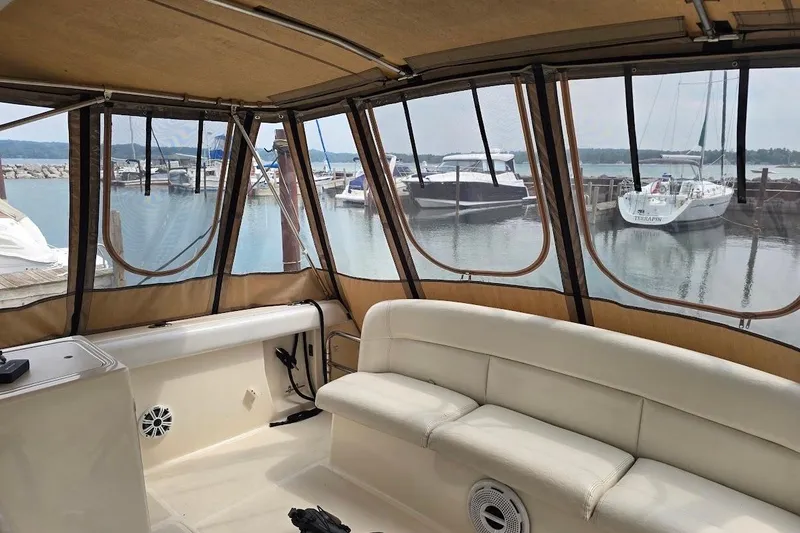 Slide: The Image of Interior view of 1995 Tiara Yachts 3500 Express with marina backdrop. - 19