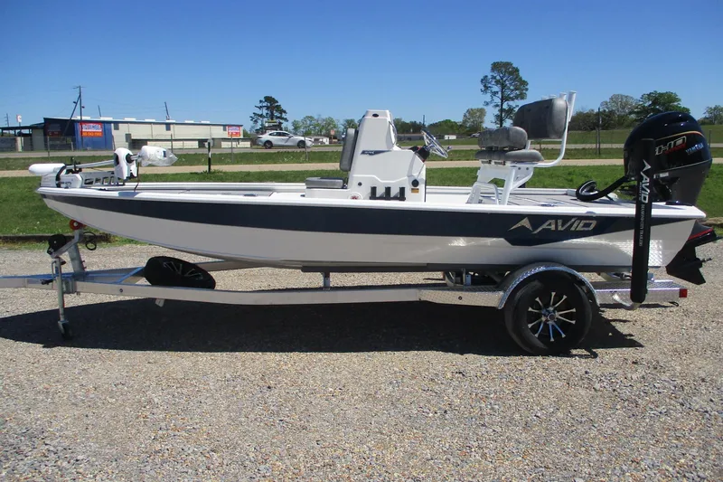 The Image of 2026 Avid 19 FSX fishing boat on trailer, parked outdoors. - 0