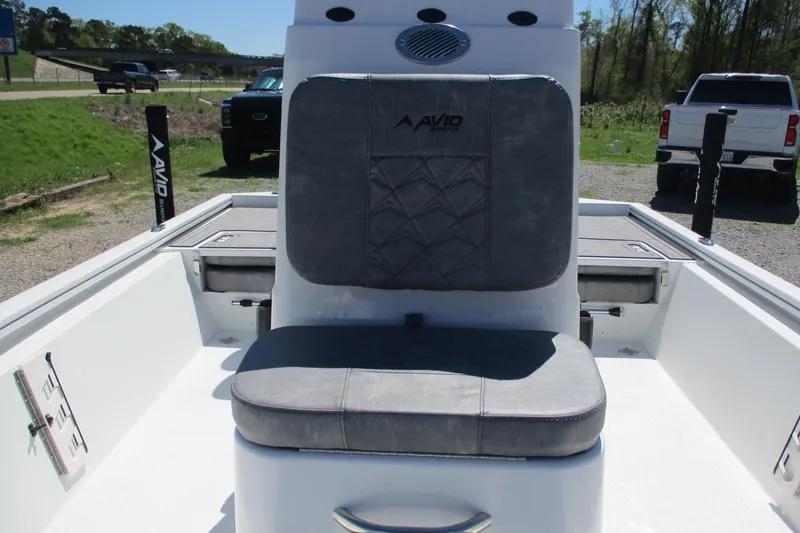 Slide: The Image of 2026 Avid 19 FSX boat interior with cushioned seating and storage compartments. - 10