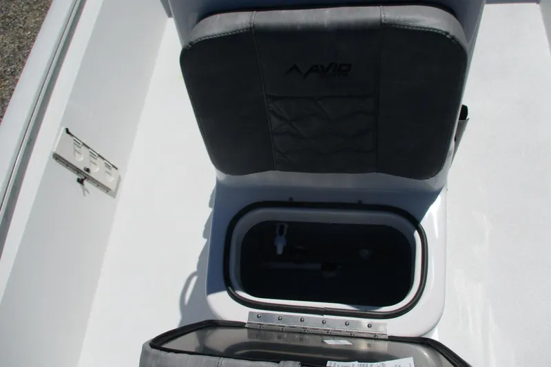Slide: The Image of Avid 19 FSX 2026 boat seat with storage compartment open. - 11