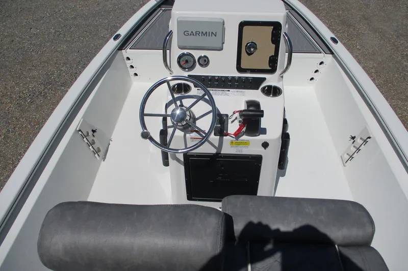 Slide: The Image of 2026 Avid 19 FSX boat console with Garmin navigation and steering wheel. - 12