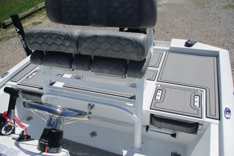 Slide: The Image of 2026 Avid 19 FSX boat interior with dual seats and steering console. - 14