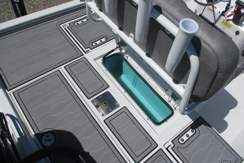 Slide: The Image of 2026 Avid 19 FSX boat interior with storage compartments and seating. - 16