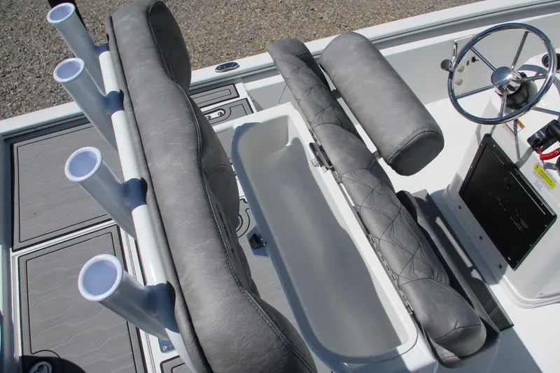 Slide: The Image of Avid 19 FSX 2026 boat interior with rod holders and steering wheel. - 17