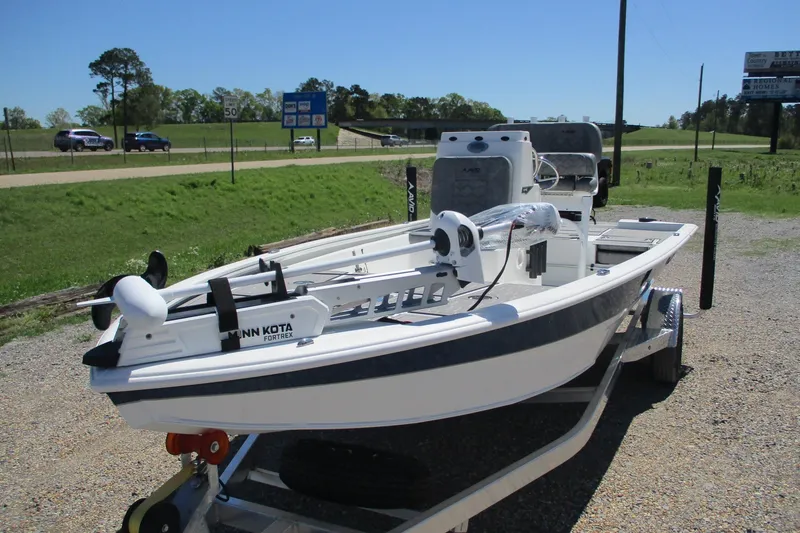 Slide: The Image of 2026 Avid 19 FSX boat on trailer, equipped with Minn Kota Fortrex motor. - 2