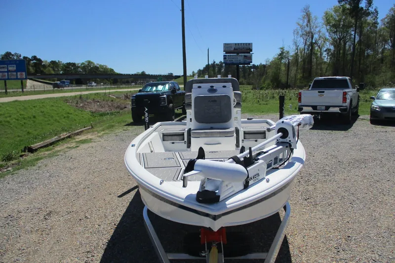 Slide: The Image of 2026 Avid 19 FSX boat parked outdoors on gravel, featuring a Minn Kota trolling motor. - 3