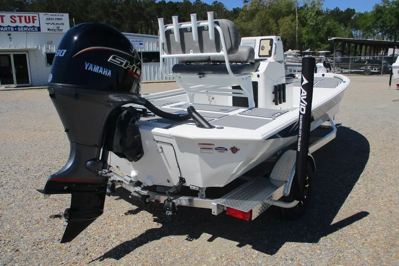 Slide: The Image of 2026 Avid 19 FSX boat with Yamaha motor, parked outdoors on a trailer. - 7