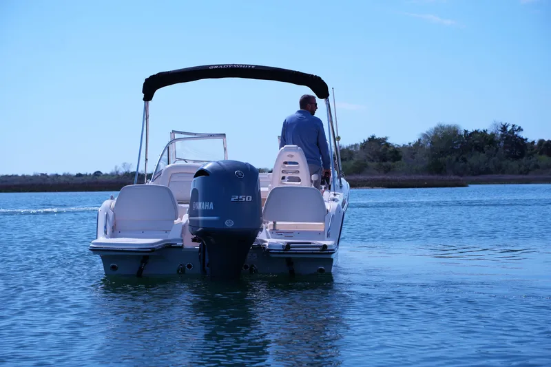 Slide: The Image of 2019 Grady-White Freedom 215 boat with Yamaha engine on calm water. - 16