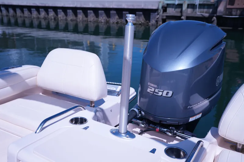 Slide: The Image of 2019 Grady-White Freedom 215 boat with Yamaha 250 engine, docked by water. - 20