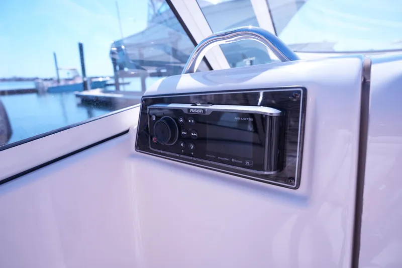 Slide: The Image of Fusion stereo system on 2019 Grady-White Freedom 215 boat dashboard. - 25