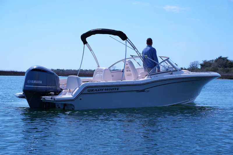 Slide: The Image of 2019 Grady-White Freedom 215 boat on water with Yamaha engine. - 3