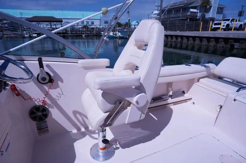 Slide: The Image of 2019 Grady-White Freedom 215 boat interior with helm seat and steering wheel. - 30