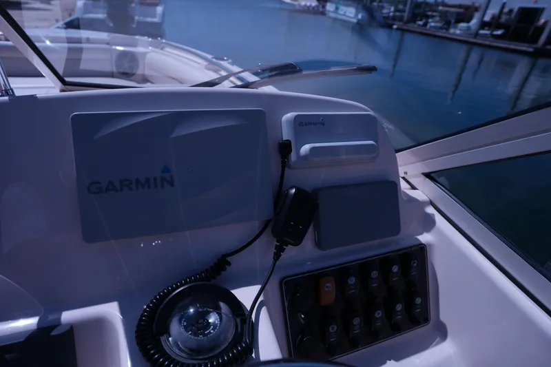 Slide: The Image of 2019 Grady-White Freedom 215 boat dashboard with Garmin navigation system. - 33