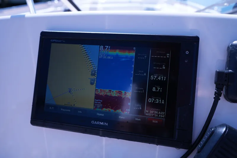 Slide: The Image of Garmin GPS display on 2019 Grady-White Freedom 215 boat dashboard. - 36