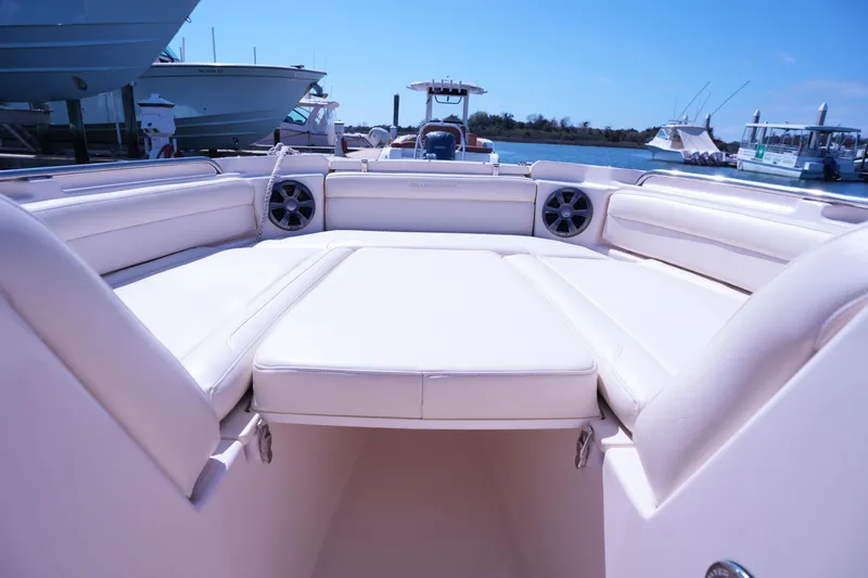 Slide: The Image of 2019 Grady-White Freedom 215 boat interior with spacious seating and speakers. - 39