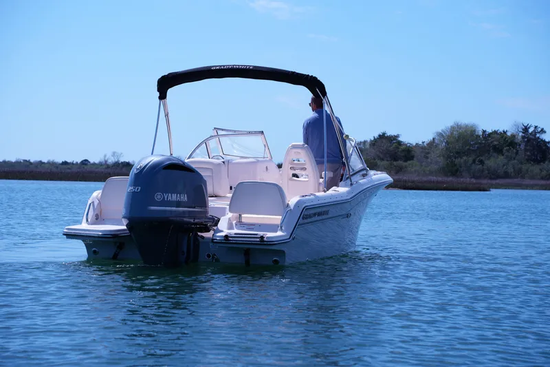 Slide: The Image of 2019 Grady-White Freedom 215 boat on calm water with Yamaha engine. - 4