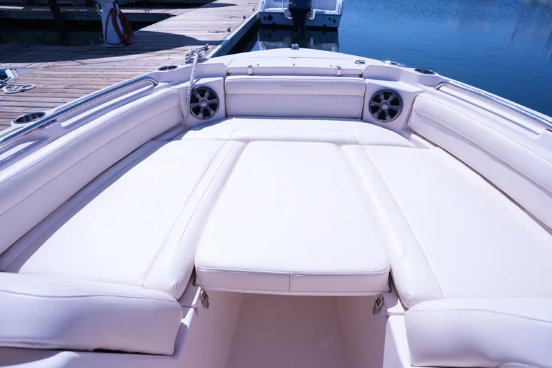 Slide: The Image of 2019 Grady-White Freedom 215 boat interior with plush seating at dock. - 40