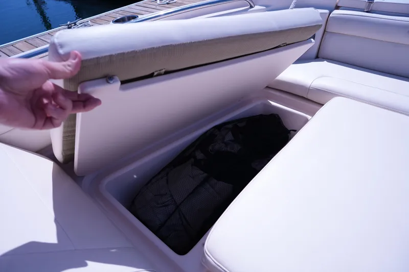 Slide: The Image of 2019 Grady-White Freedom 215 boat seat storage compartment open on deck. - 41