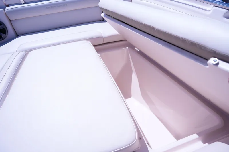 Slide: The Image of 2019 Grady-White Freedom 215 boat interior storage compartment with cushioned seating. - 42