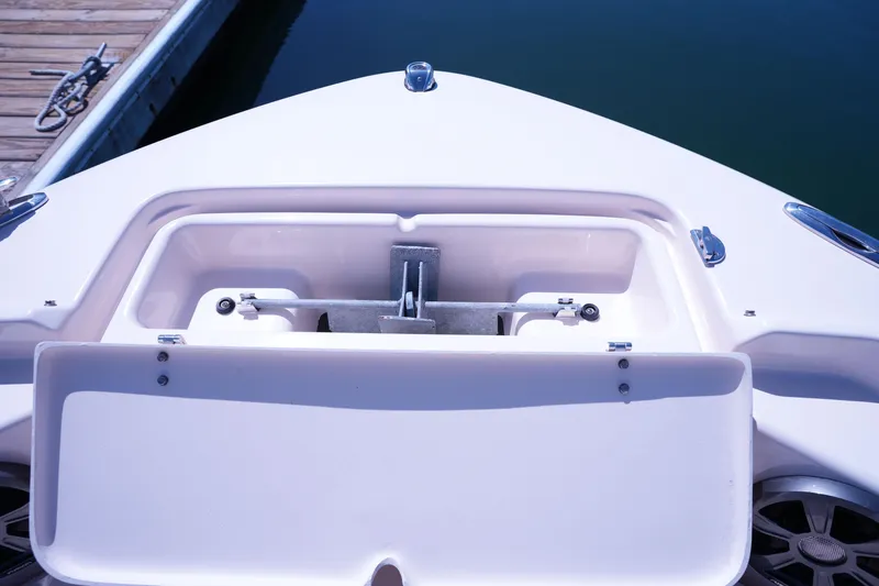 Slide: The Image of 2019 Grady-White Freedom 215 boat anchor compartment at dockside. - 44